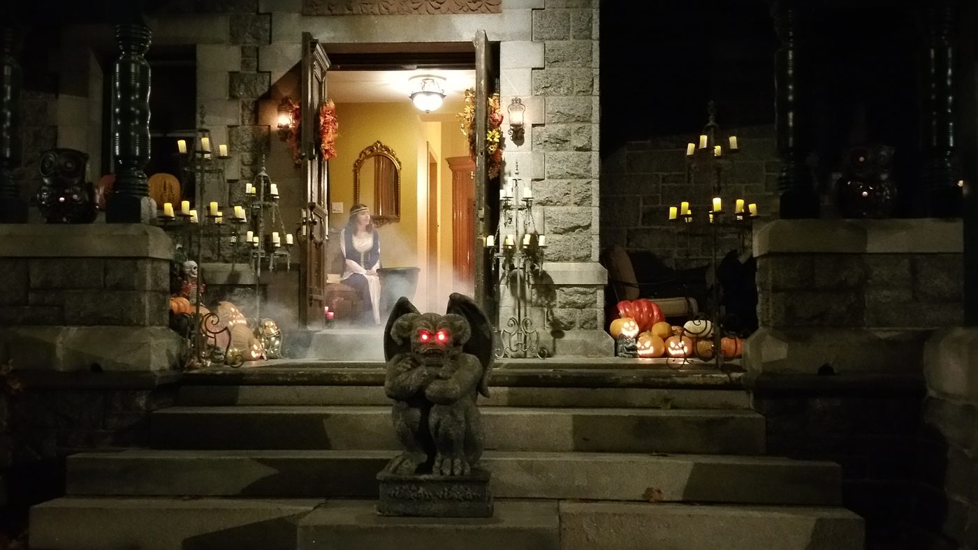 A gargoyle in the fog at the doorway